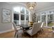 Sunlit dining room with a large window and seating for six at 272 Porters Glen Ln, New London, NC 28127