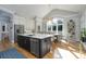 Open kitchen boasts an island, breakfast area, and stainless steel appliances at 272 Porters Glen Ln, New London, NC 28127