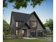 Two-story home with dark gray siding, brick accents, and a three-car garage at 3025 Kinger Ln, Matthews, NC 28105