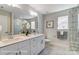 Elegant bathroom with double vanity and marble tile at 4260 Black Ct # 230, Harrisburg, NC 28075