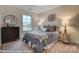 Bright bedroom with a queen bed and decorative wall art at 4268 Black Ct # 229, Harrisburg, NC 28075