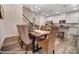 Open concept dining area with kitchen views and wood dining table at 4268 Black Ct # 229, Harrisburg, NC 28075