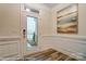 Bright entryway with wood floors and wall art at 4268 Black Ct # 229, Harrisburg, NC 28075