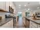 Spacious kitchen with stainless steel appliances and granite counters at 4268 Black Ct # 229, Harrisburg, NC 28075