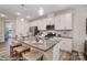 Kitchen island with seating and granite countertop at 4268 Black Ct # 229, Harrisburg, NC 28075