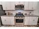 Stainless steel stove and microwave in modern kitchen at 4268 Black Ct # 229, Harrisburg, NC 28075