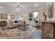 Spacious living room with comfortable seating and large windows, providing natural light at 4268 Black Ct # 229, Harrisburg, NC 28075