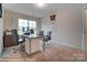 Home office with a desk, chairs, and large window at 4268 Black Ct # 229, Harrisburg, NC 28075
