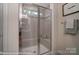Large walk in shower with neutral tile and glass door at 4268 Black Ct # 229, Harrisburg, NC 28075