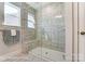 Large walk-in shower with marble tile and bench at 4276 Black Ct # 228, Harrisburg, NC 28075