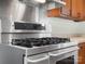 Stainless steel gas range with multiple burners and a digital display at 4333 Tipperary Pl, Charlotte, NC 28215