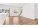 Spacious dining area with hardwood floors, large window, and access to back patio at 543 San Marco Dr # 16, Gastonia, NC 28056