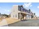 Two-story townhome with gray siding, brick accents, and a landscaped front yard at 543 San Marco Dr # 16, Gastonia, NC 28056