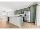 Modern kitchen with green cabinets, quartz countertops, and stainless steel appliances at 543 San Marco Dr # 16, Gastonia, NC 28056