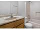 Bathroom with wood vanity, beige sink, and shower/tub combo at 61 17Th Street Nw Pl, Hickory, NC 28601