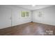 Simple living room with wood-look flooring and neutral walls at 61 17Th Street Nw Pl, Hickory, NC 28601