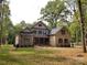 A spacious home with a combination of brick and stone, complemented by a well-manicured lawn and mature trees at 6507 Rehobeth Rd # 4, Waxhaw, NC 28173