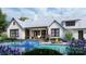 A backyard oasis features a luxurious pool, a cozy seating area with a fire pit, and lush landscaping at 6515 Rehobeth Rd # 2, Waxhaw, NC 28173