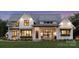 Charming two-story home featuring a welcoming front porch, lush lawn, and beautiful architectural details at 6515 Rehobeth Rd # 2, Waxhaw, NC 28173