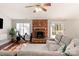 Living room with hardwood floors, fireplace, and sectional sofa at 714 Mattingwood Dr, Charlotte, NC 28270