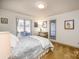 Bedroom with double bed, carpet, and views of the backyard at 130 Sandy Shore Dr, Mooresville, NC 28117