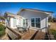 Wooden deck with table and chairs, offering lake views at 130 Sandy Shore Dr, Mooresville, NC 28117