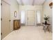 Bright entryway with new carpet, a small table, and an antique cabinet at 130 Sandy Shore Dr, Mooresville, NC 28117