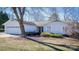 Single-story home with attached garage and landscaping at 130 Sandy Shore Dr, Mooresville, NC 28117