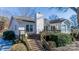 White house back, wooden deck, stairs leading down to yard at 130 Sandy Shore Dr, Mooresville, NC 28117