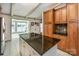 Kitchen features granite countertops and views of the lake at 130 Sandy Shore Dr, Mooresville, NC 28117