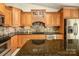 Kitchen with granite countertops, wooden cabinets, and stainless steel appliances at 130 Sandy Shore Dr, Mooresville, NC 28117
