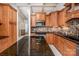 Kitchen with granite island and wood cabinets at 130 Sandy Shore Dr, Mooresville, NC 28117
