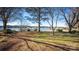 Lakefront view with dock and clear water at 130 Sandy Shore Dr, Mooresville, NC 28117