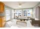 Sunroom with lake views and comfortable seating at 130 Sandy Shore Dr, Mooresville, NC 28117