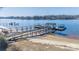 Aerial view of waterfront property with multiple docks at 130 Sandy Shore Dr, Mooresville, NC 28117