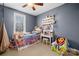 Cozy bedroom with a twin bed and storage solutions at 144 Spring Forest Dr, Shelby, NC 28152