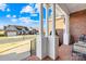 Inviting covered porch with brick columns and a view of a serene neighborhood street at 144 Spring Forest Dr, Shelby, NC 28152