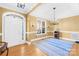 Dining area with chandelier, hardwood floors, and front door entrance at 144 Spring Forest Dr, Shelby, NC 28152