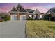 Charming brick home featuring a two-car garage, manicured landscaping, and inviting entrance at 144 Spring Forest Dr, Shelby, NC 28152