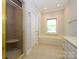 Bathroom featuring a glass shower, bathtub, and ample lighting at 1448-1 New Prospect Church Rd, Shelby, NC 28150