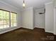 Neutral toned bedroom with carpet flooring, large windows, and crown molding at 1448-1 New Prospect Church Rd, Shelby, NC 28150