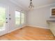 Bright dining room with hardwood floors, large windows and access to outdoor space at 1448-1 New Prospect Church Rd, Shelby, NC 28150