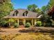 Inviting exterior view of home featuring a charming front porch and mature landscaping at 1448-1 New Prospect Church Rd, Shelby, NC 28150