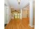 Open foyer with hardwood flooring, leading to the staircase and living spaces at 1448-1 New Prospect Church Rd, Shelby, NC 28150