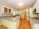 Charming kitchen with white cabinets, granite counters, and hardwood floors at 1448-1 New Prospect Church Rd, Shelby, NC 28150