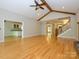 Spacious living room with hardwood floors, ceiling fan, and staircase at 1448-1 New Prospect Church Rd, Shelby, NC 28150