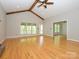 Bright and spacious living room with hardwood floors, exposed beams, and ample natural light at 1448-1 New Prospect Church Rd, Shelby, NC 28150