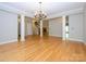 Expansive living room with hardwood floors and fireplace and access to other living areas at 1448-1 New Prospect Church Rd, Shelby, NC 28150