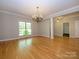 Living room with hardwood floors, a chandelier, and seamless flow into other areas at 1448-1 New Prospect Church Rd, Shelby, NC 28150