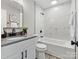 Modern bathroom with marble wall tiles, vanity, soaking tub, and modern fixtures at 2000 Patio Ct # 129, Charlotte, NC 28205